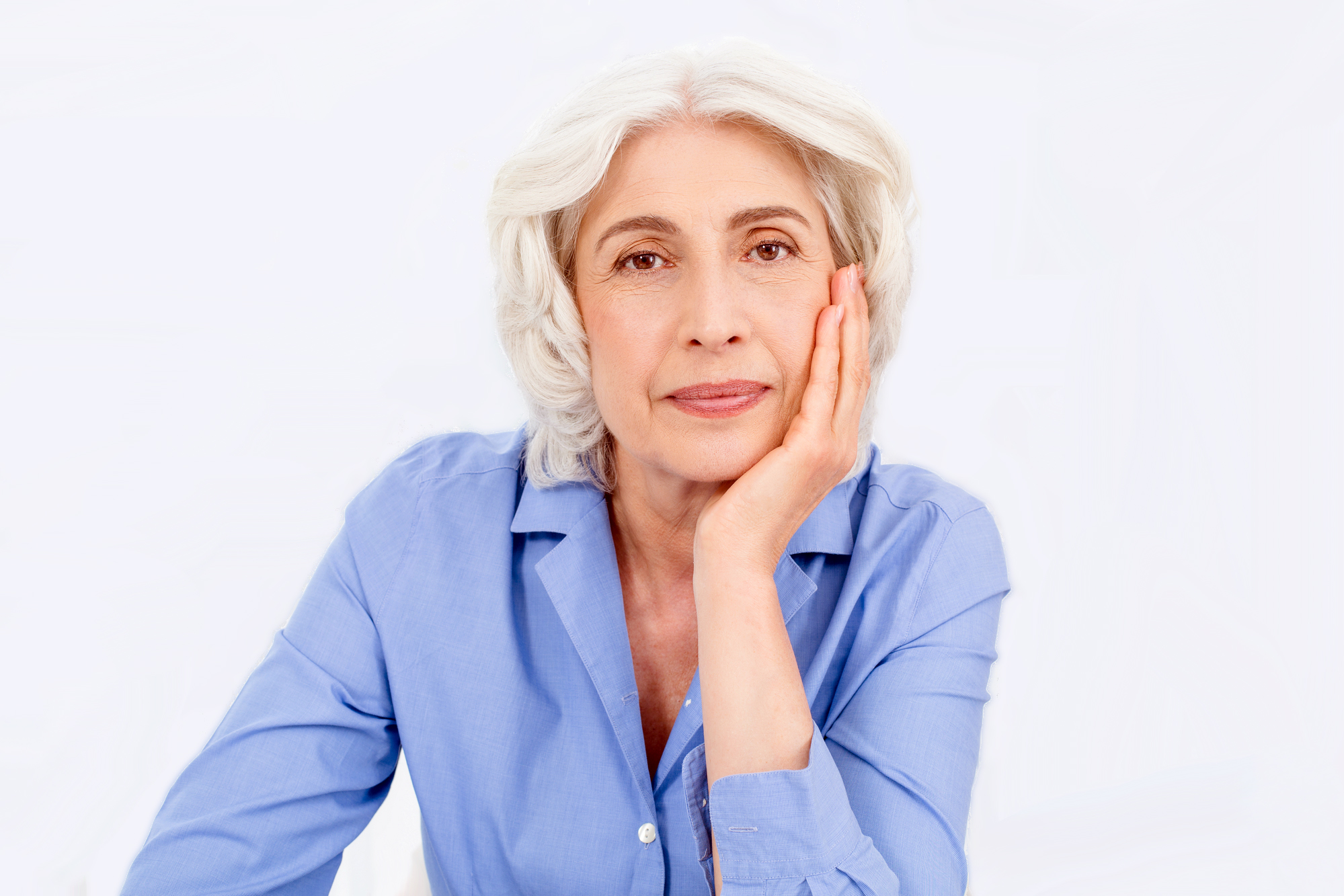 older woman with her hand on the side of her face